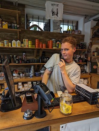 Philip ready to awnser the phone at HepCat Store in Lund