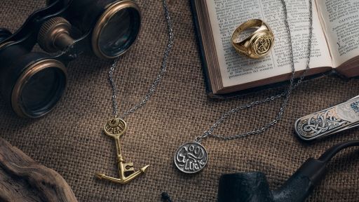 O.P Jewellery: A table with an meticulously crafted anchor, pendant and ring Jewellery